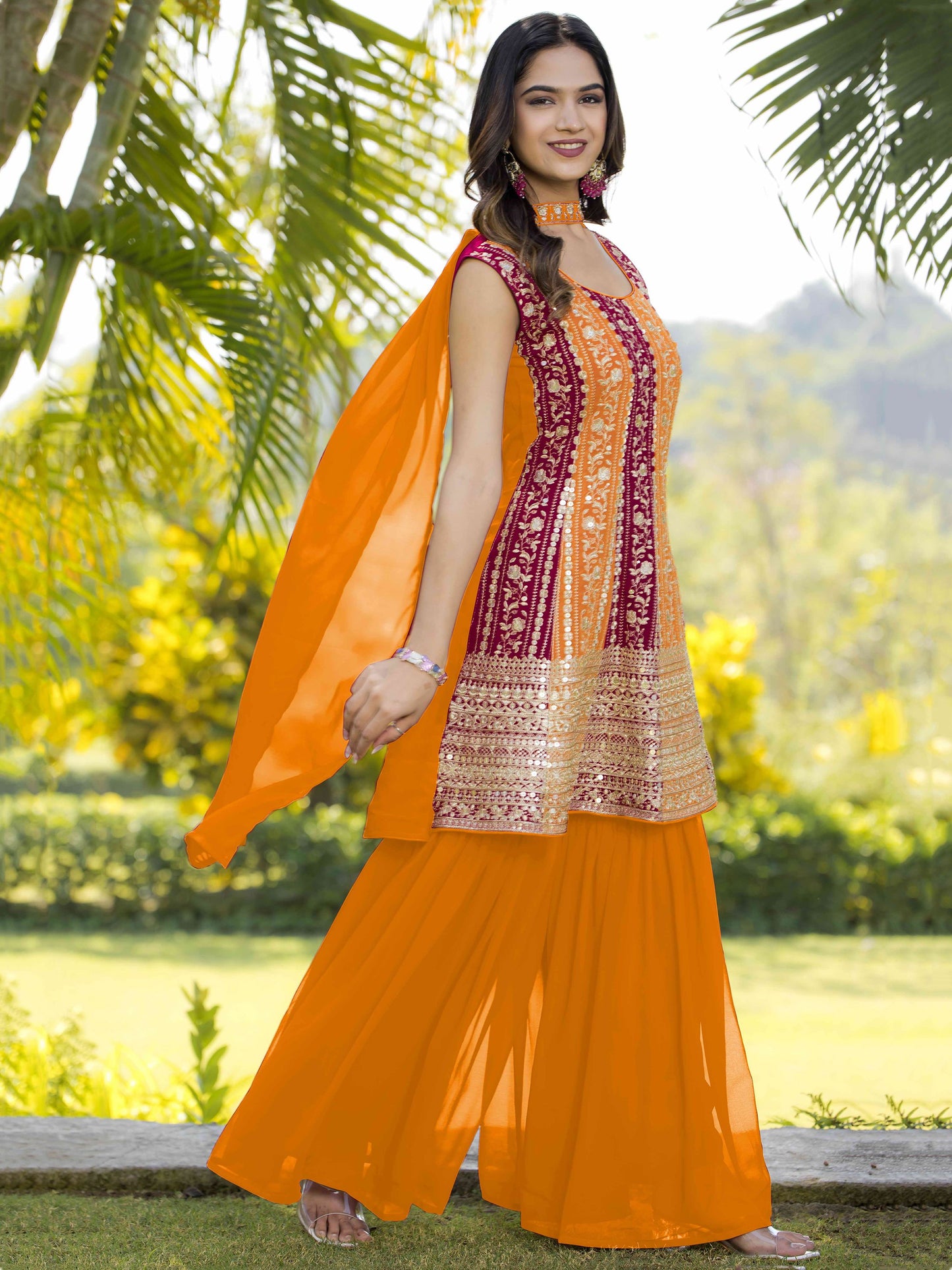 Orange color georgette sharara suit with dupatta design