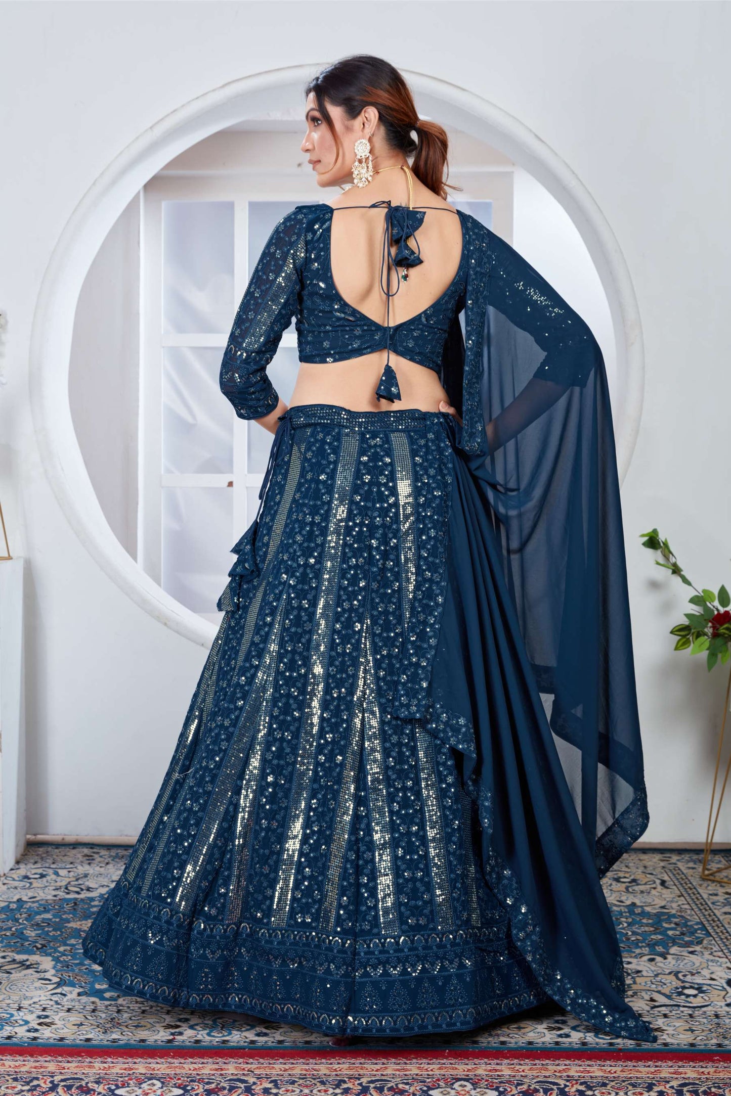 Teal color georgette lehenga choli with dupatta design