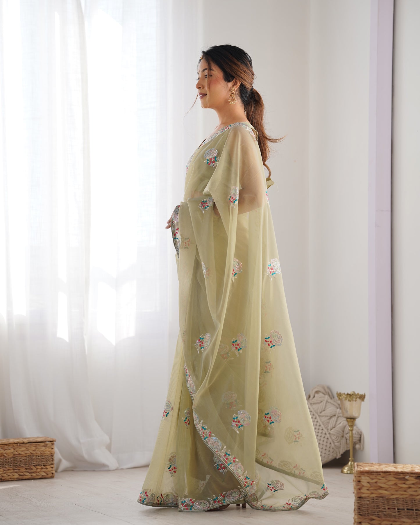 Pista color gold twill net saree for wedding