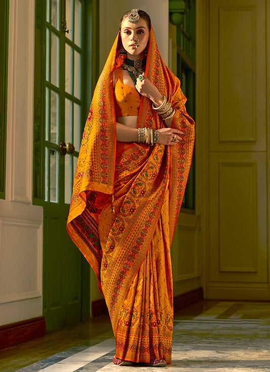 Orange color banarasi silk saree for party