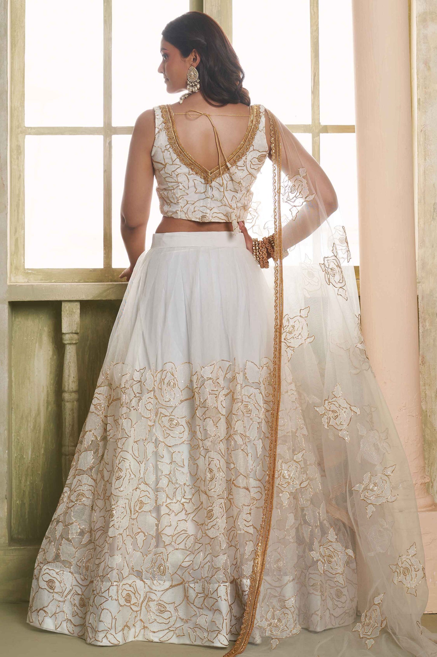 Off white color butterfly net lehenga choli for reception