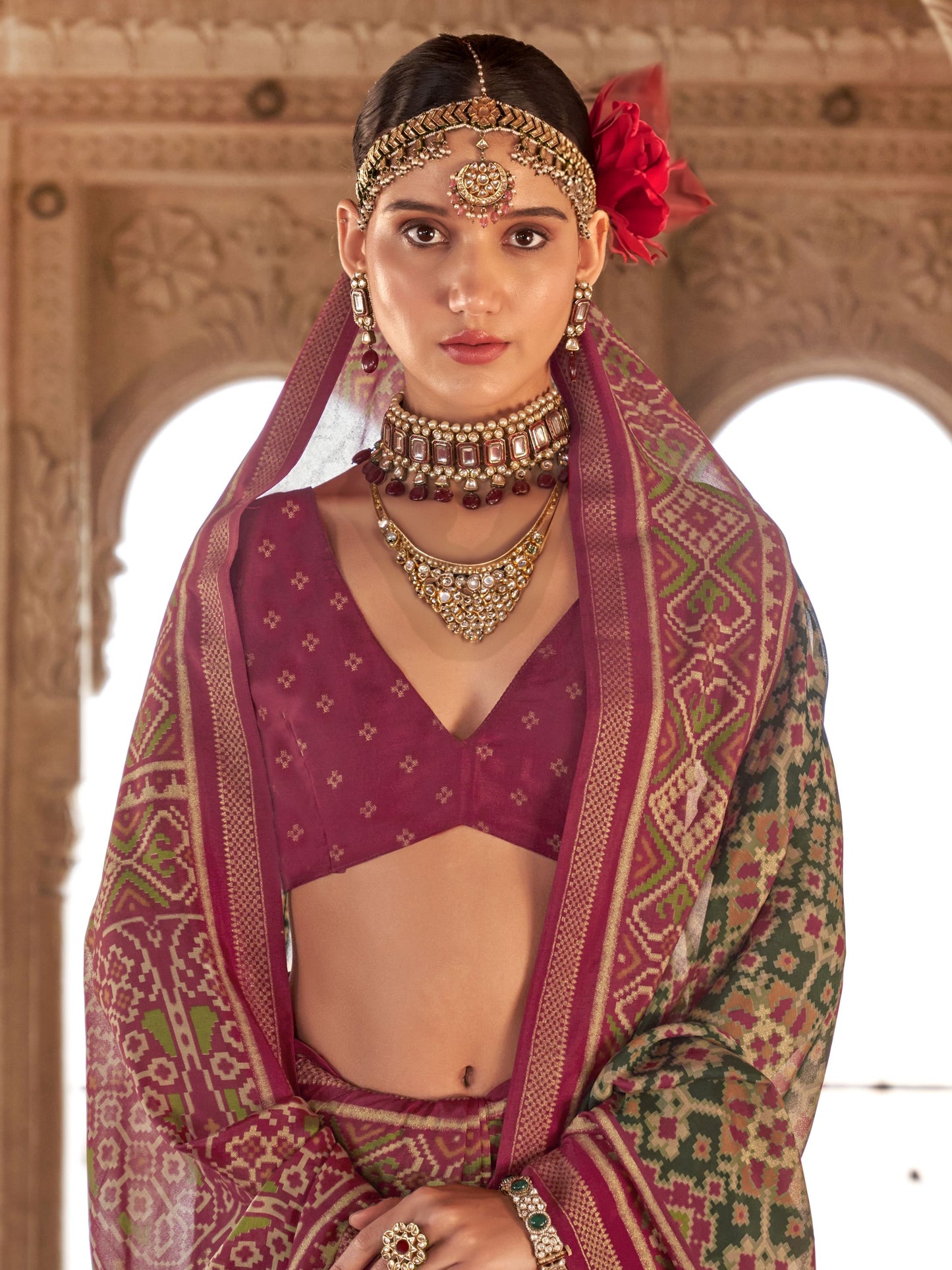 Green color georgette patola printed saree with blouse images