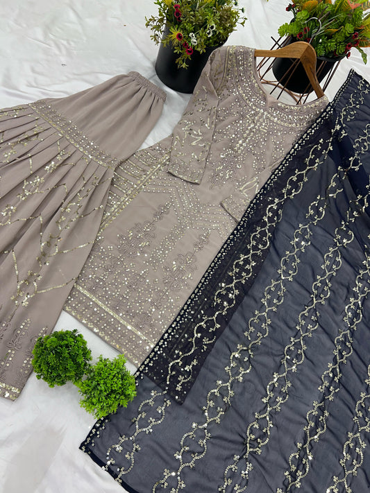 Beige color georgette sharara suit with dupatta