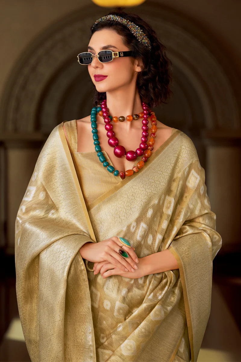 Beige color tissue silk weaving saree with blouse
