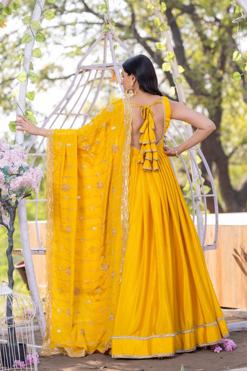 Yellow color chinon silk gown price