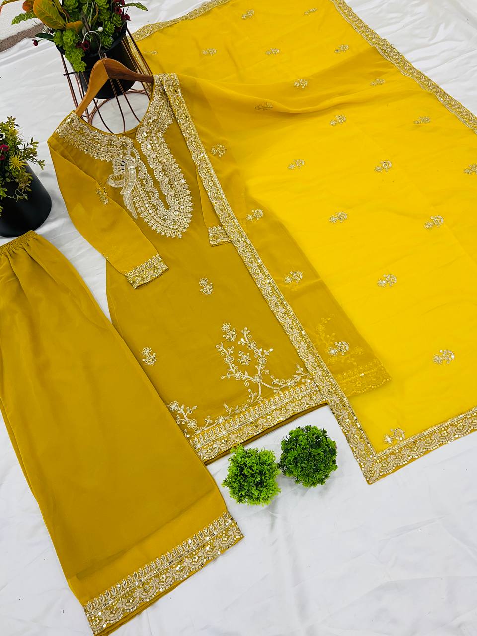 Yellow color georgette sharara suit with dupatta images