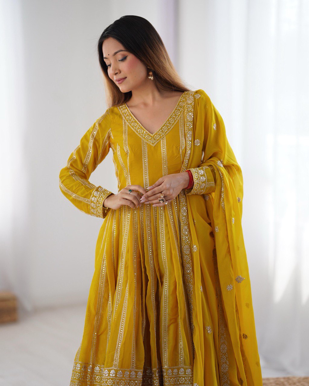 Yellow color star georgette gown with dupatta images