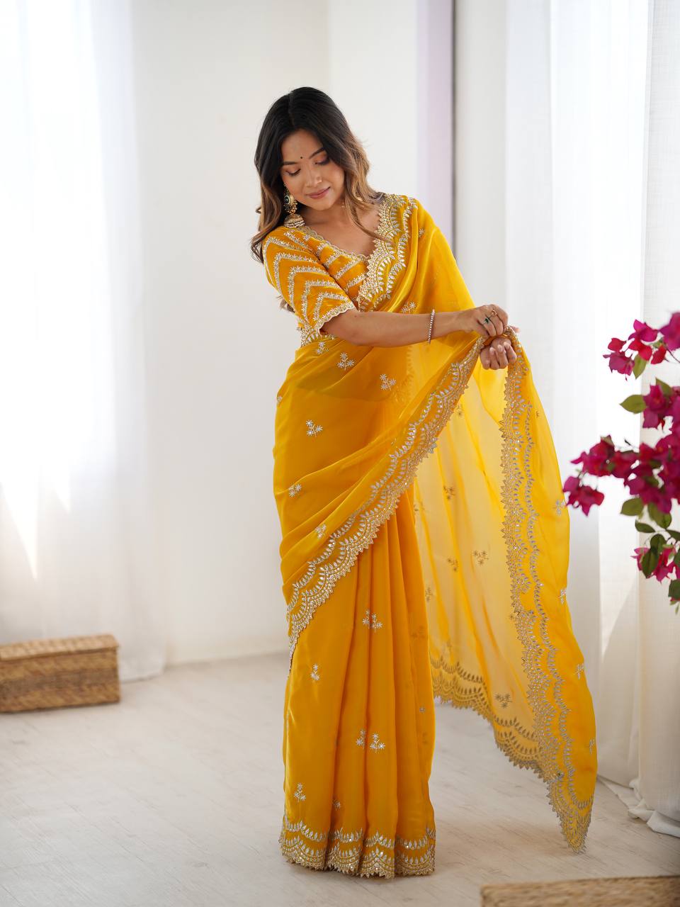 Yellow color jimmy choo saree with blouse