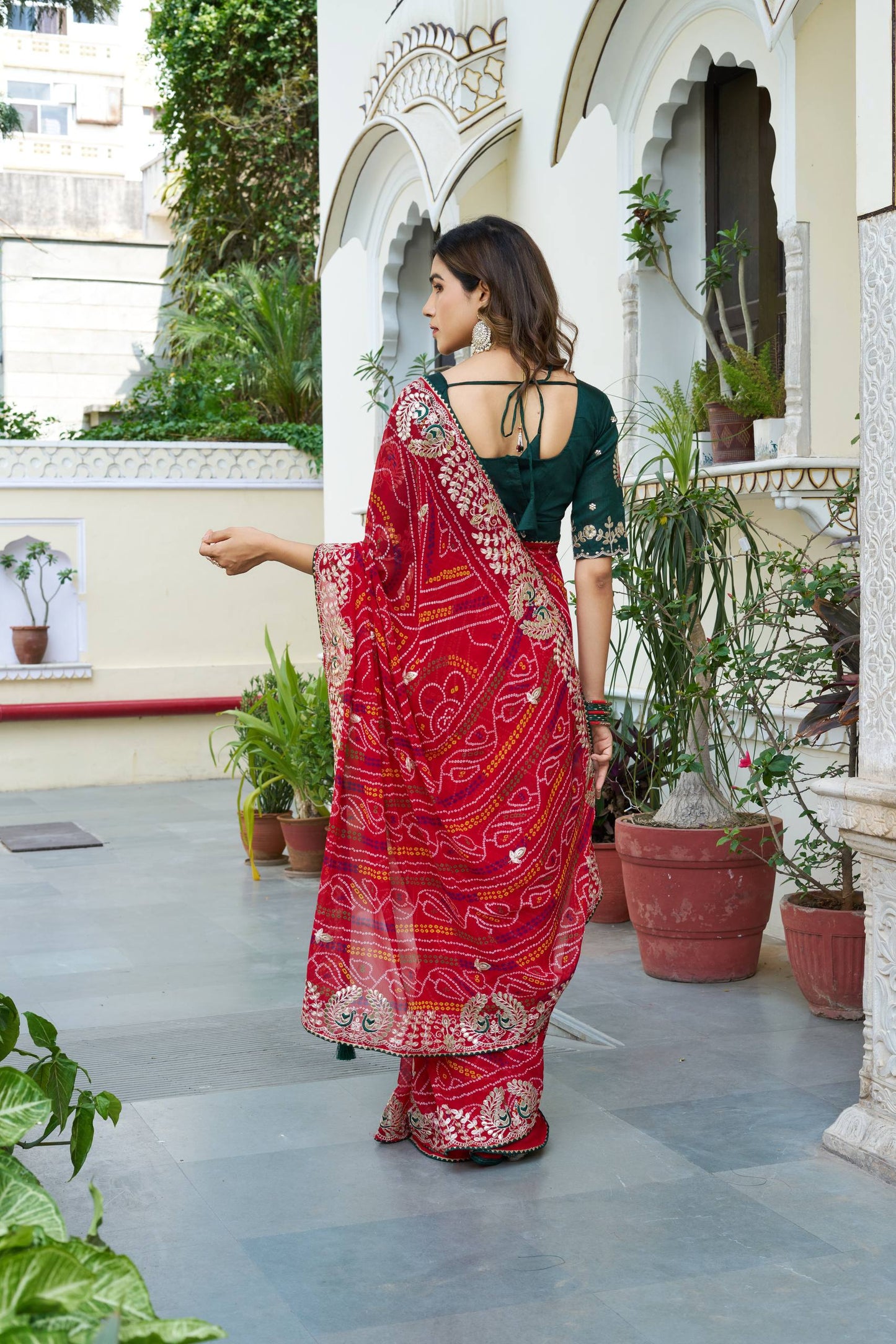 Red color bandhej saree for party