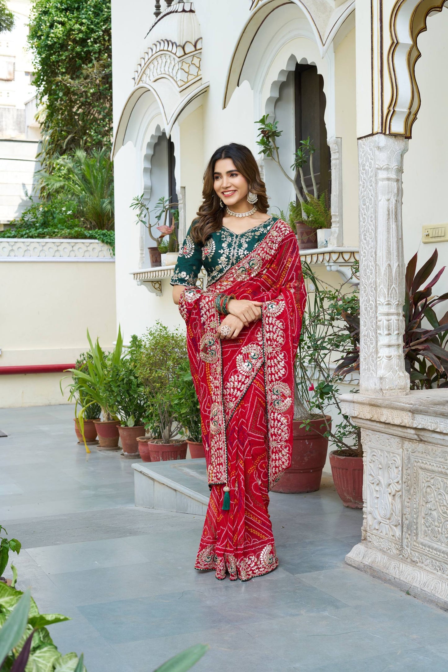 Elegance red color bandhej saree with blouse