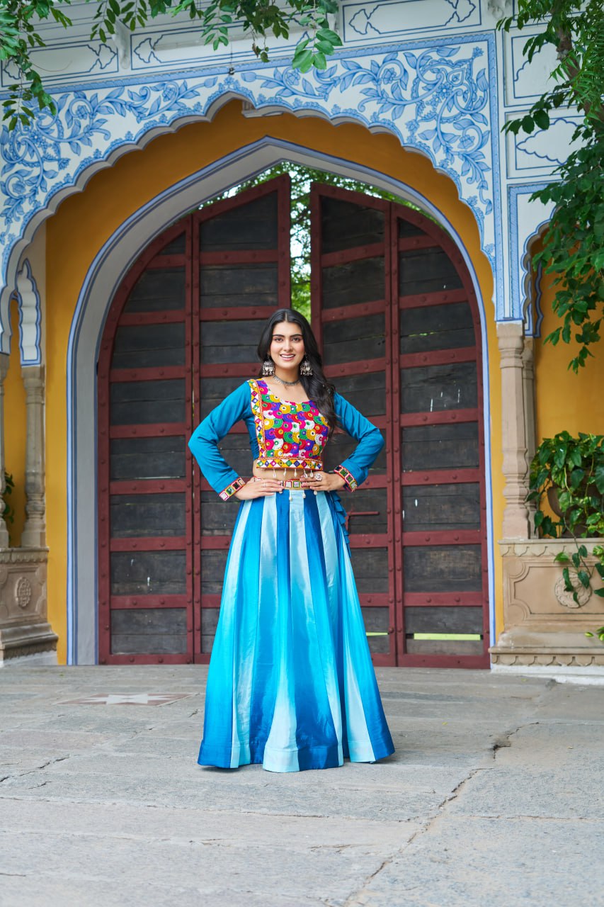 blue garba dress Midnight blue magic for the Garba nights Draped in elegance with our stunning Navratri special lehenga choli featuring: Rich midnight blue flair lehenga with grand volume Intricate mirror work