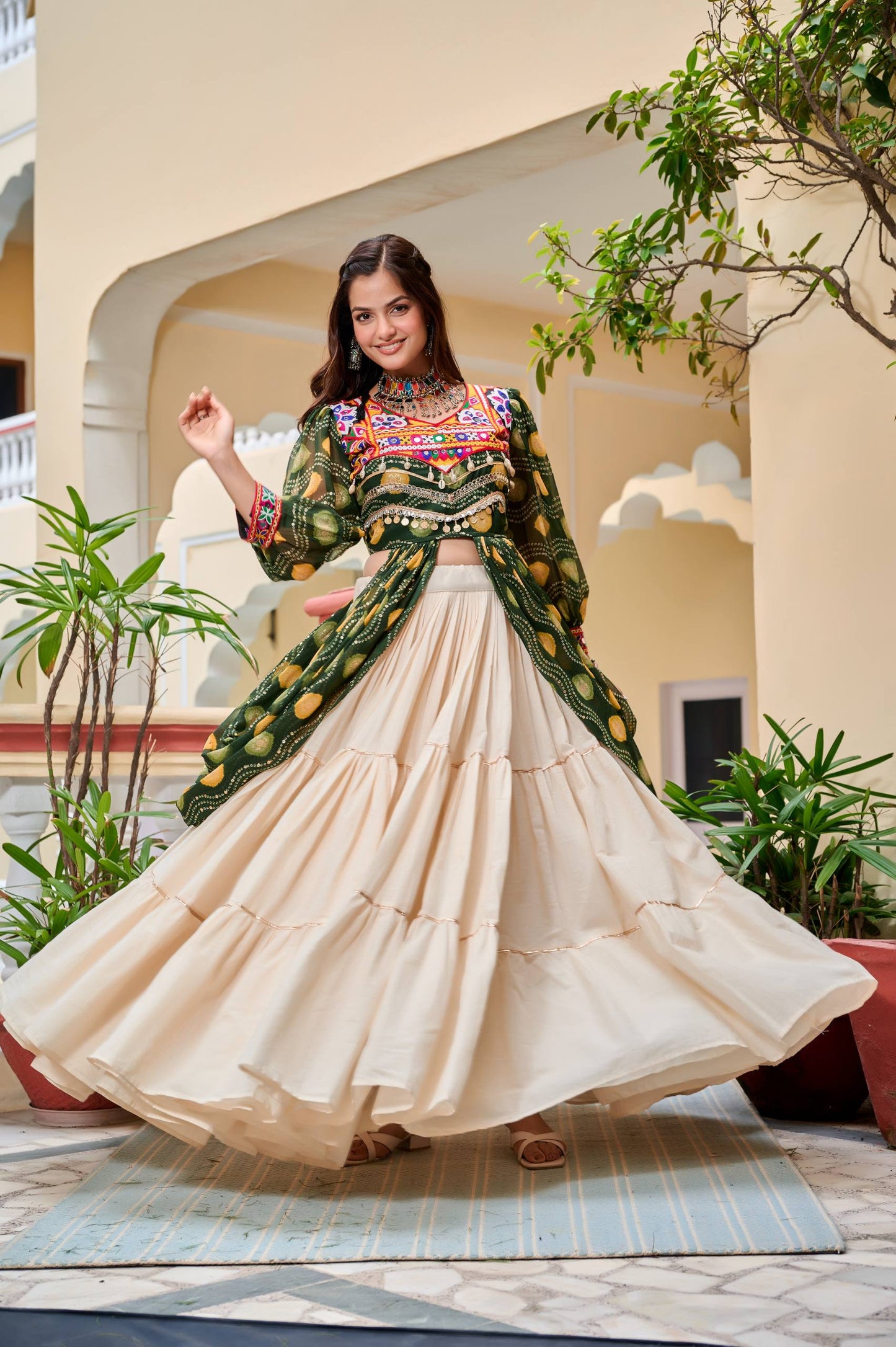 Green mirror work lehenga with shrug