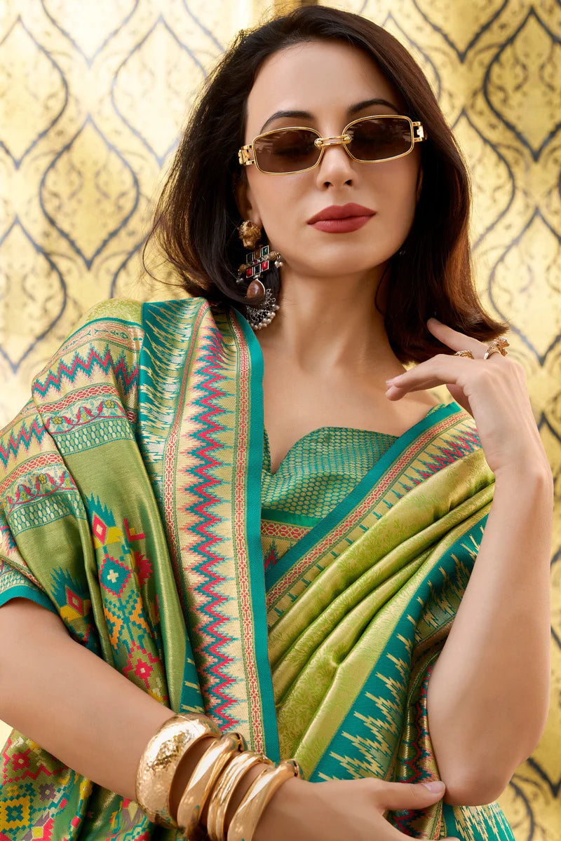 Green color tissue silk saree with blouse images
