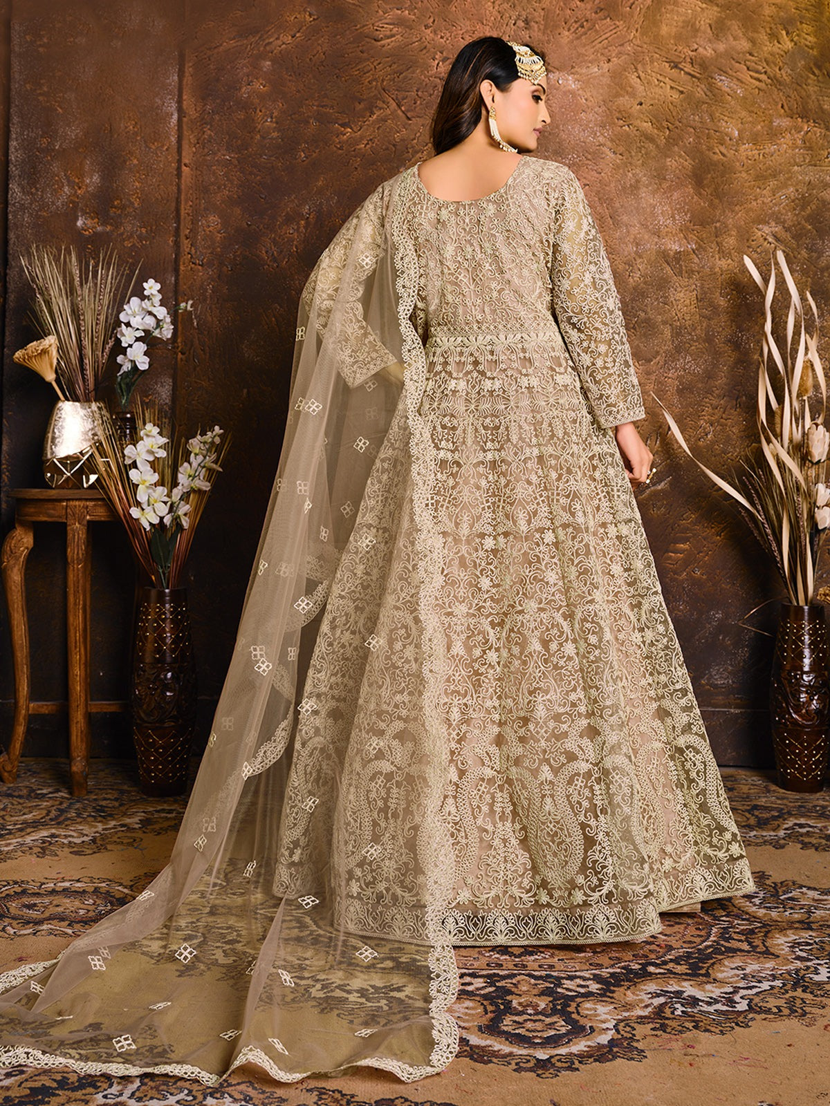Beige color net gown for women wedding
