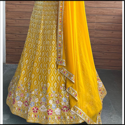 Yellow color georgette lehenga choli with dupatta images