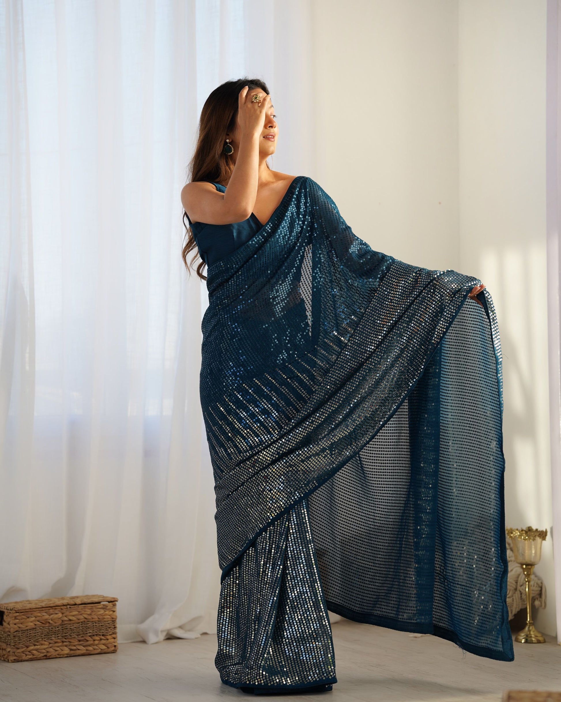 Teal blue color georgette saree
