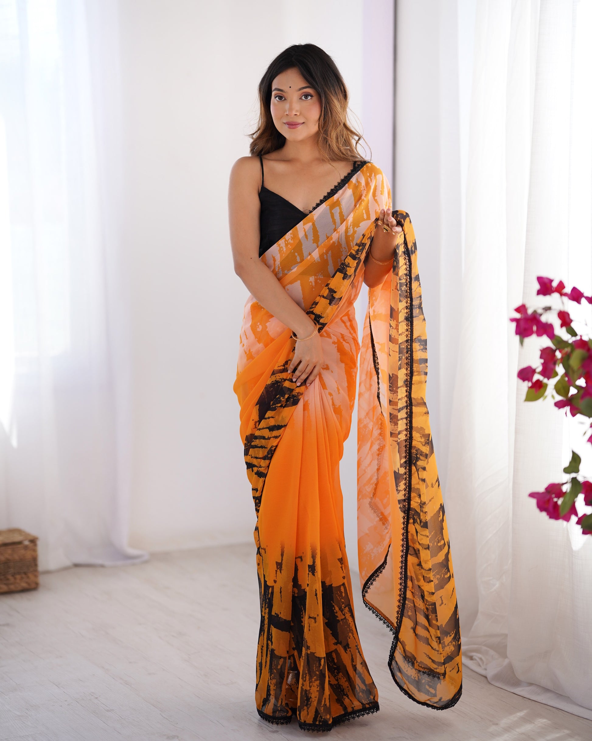 Orange color georgette saree for party