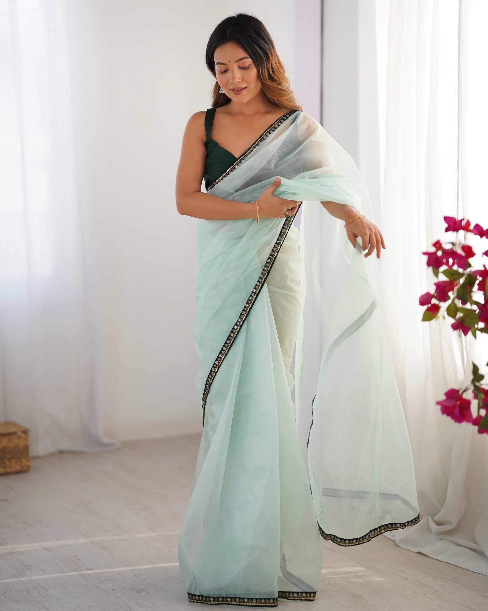 Sea green color twill net saree with blouse online