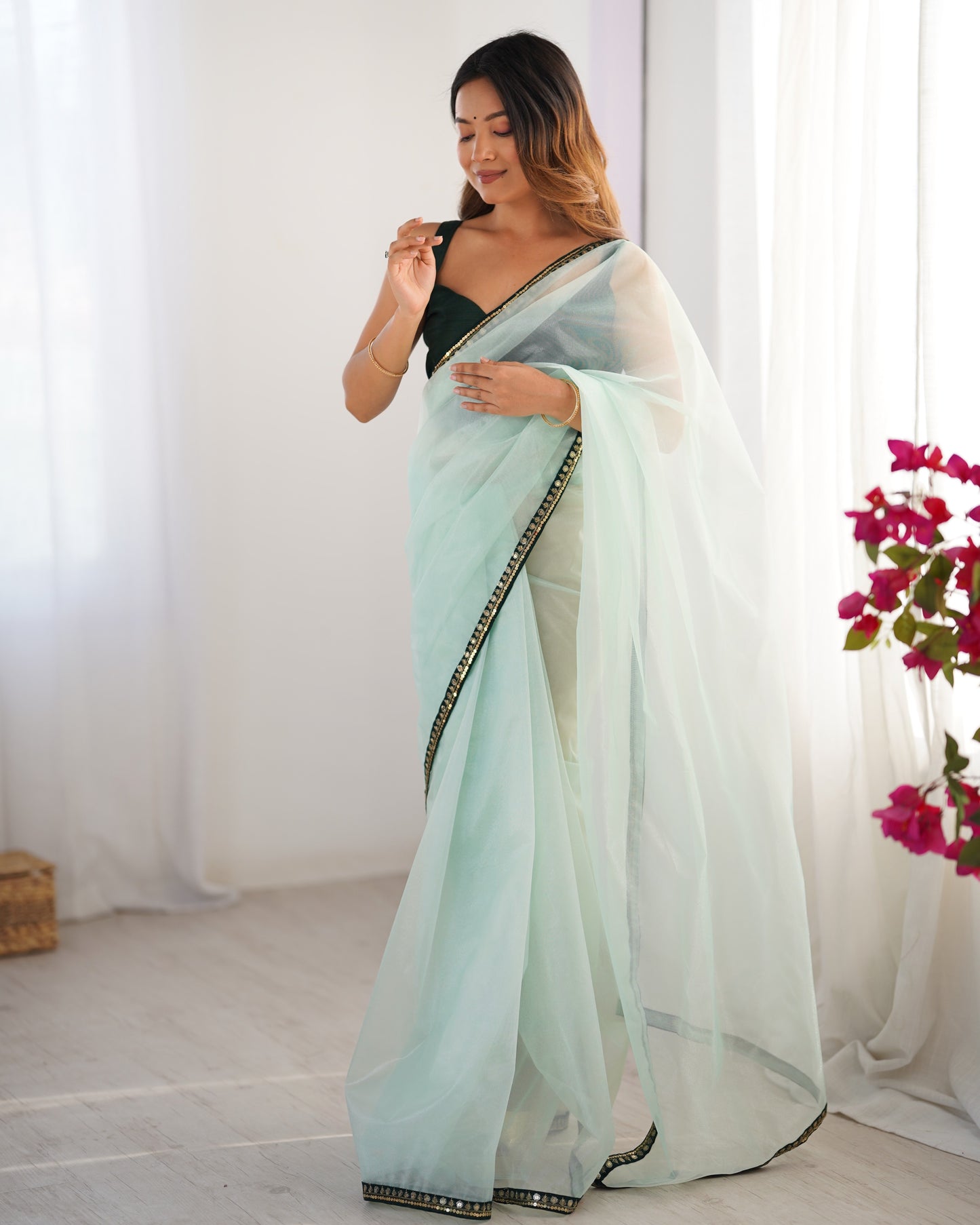 Sea green color twill net saree with blouse design