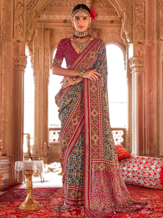 Green color georgette patola printed saree with blouse