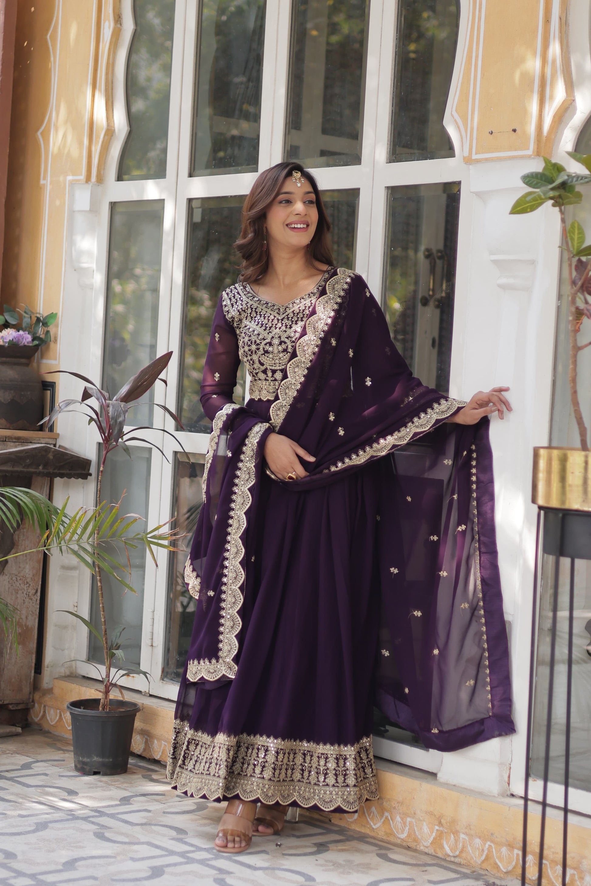 Purple color faux blooming anarkali gown design
