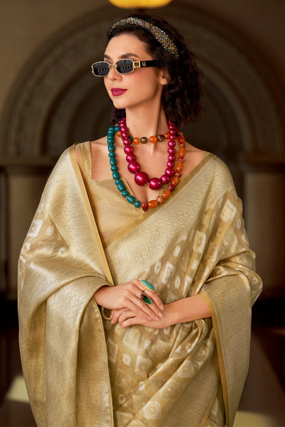 Beige color tissue silk weaving saree with blouse