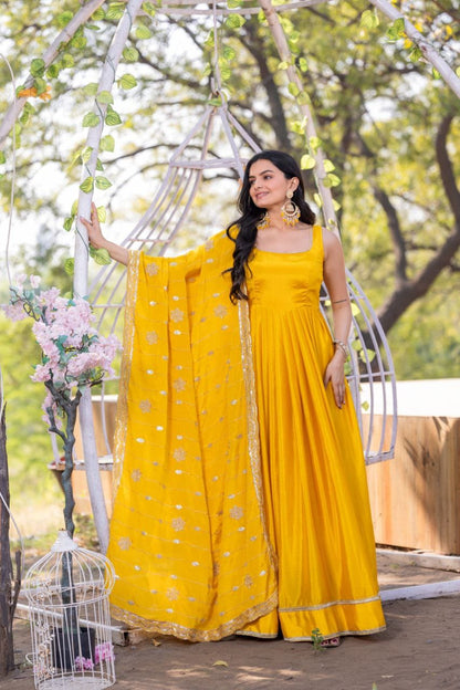 Yellow color chinon silk gown for haldi rasam