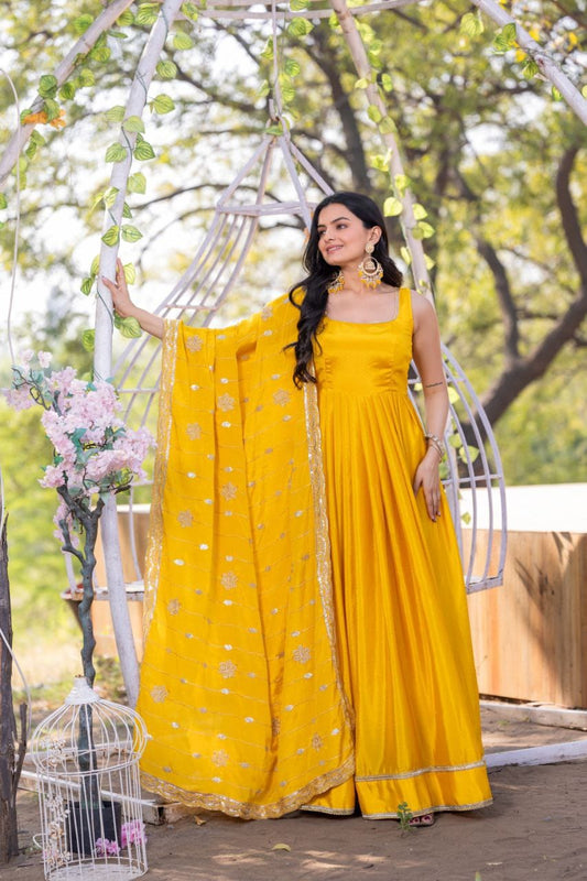 Yellow color chinon silk gown for haldi rasam
