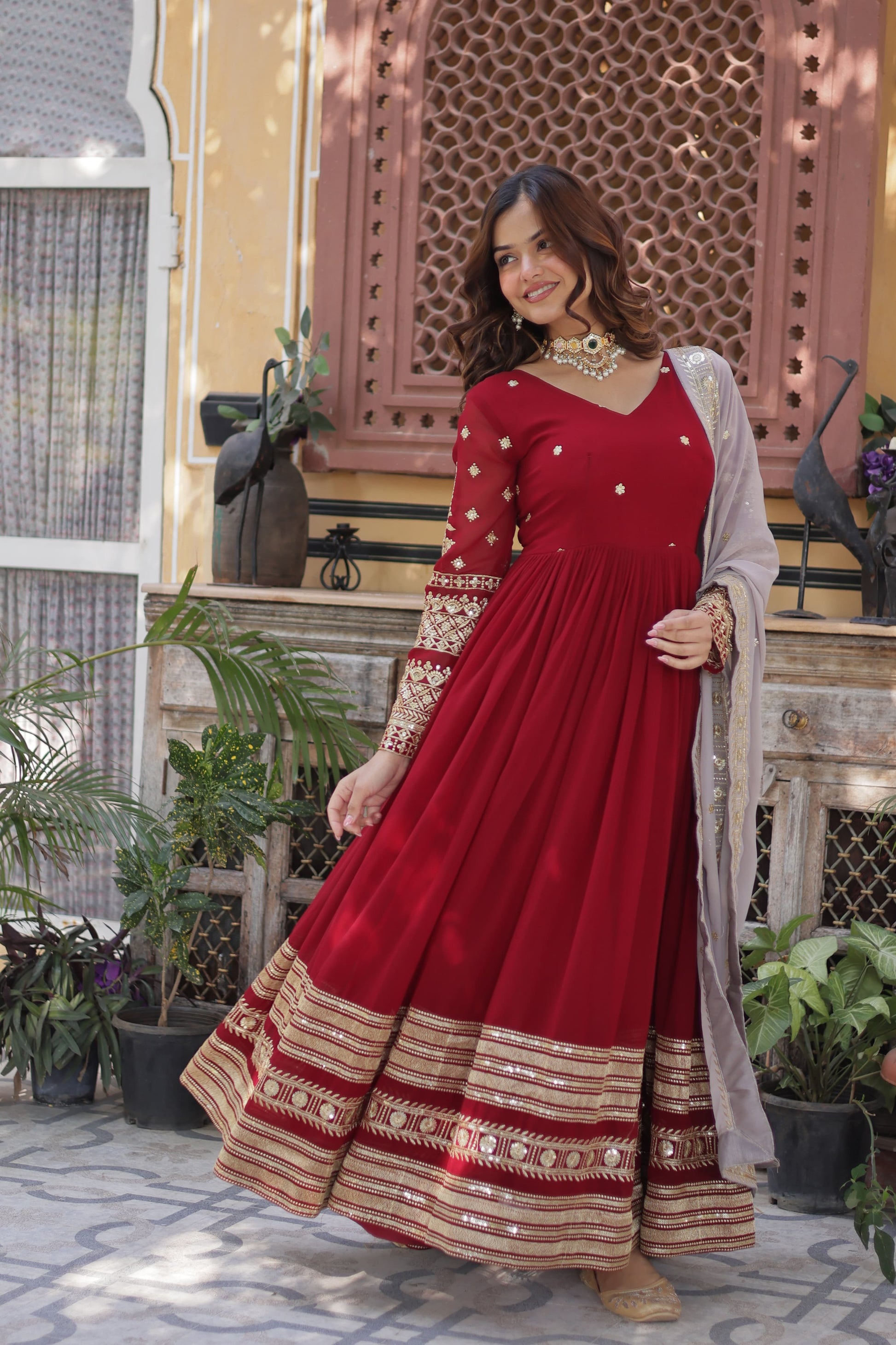 Red color faux blooming long gown with dupatta images