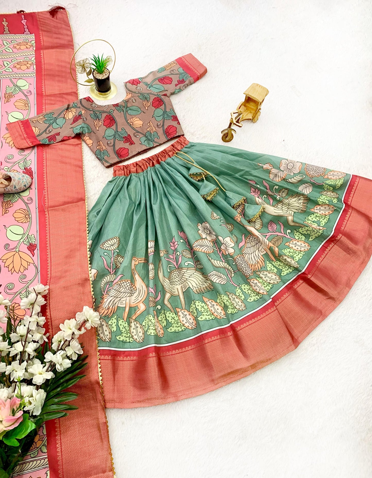 Green color dola silk kalamkari printed lehenga choli with dupatta design