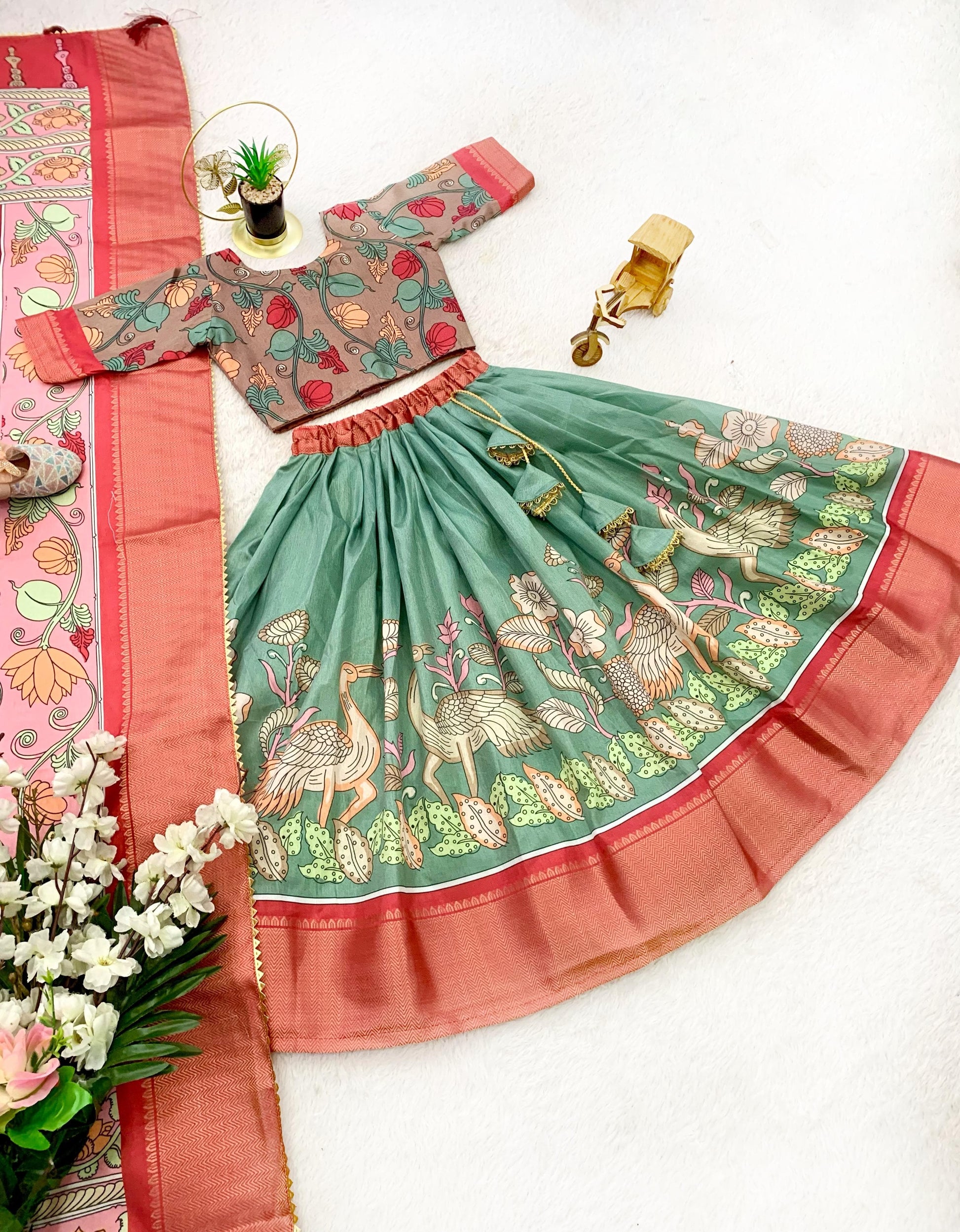 Green color dola silk kalamkari printed lehenga choli with dupatta design