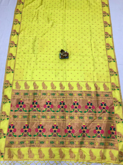 Yellow color lichi silk saree with blouse