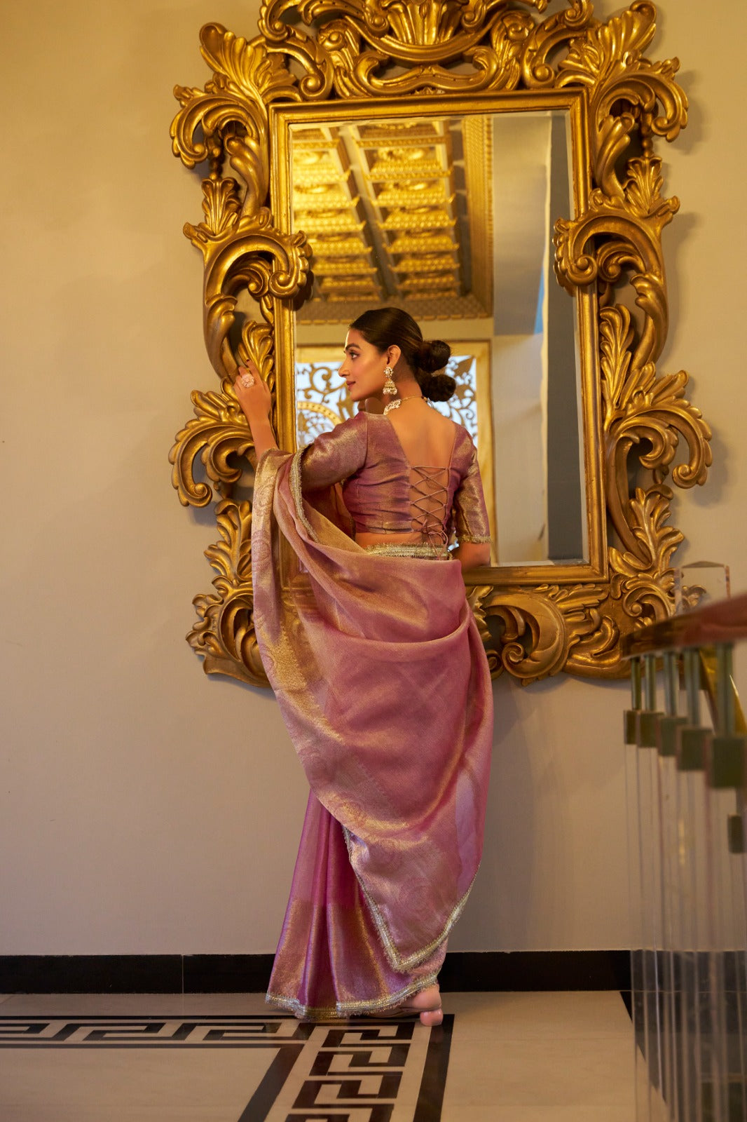 Light pink color tissue shimmer saree with blouse