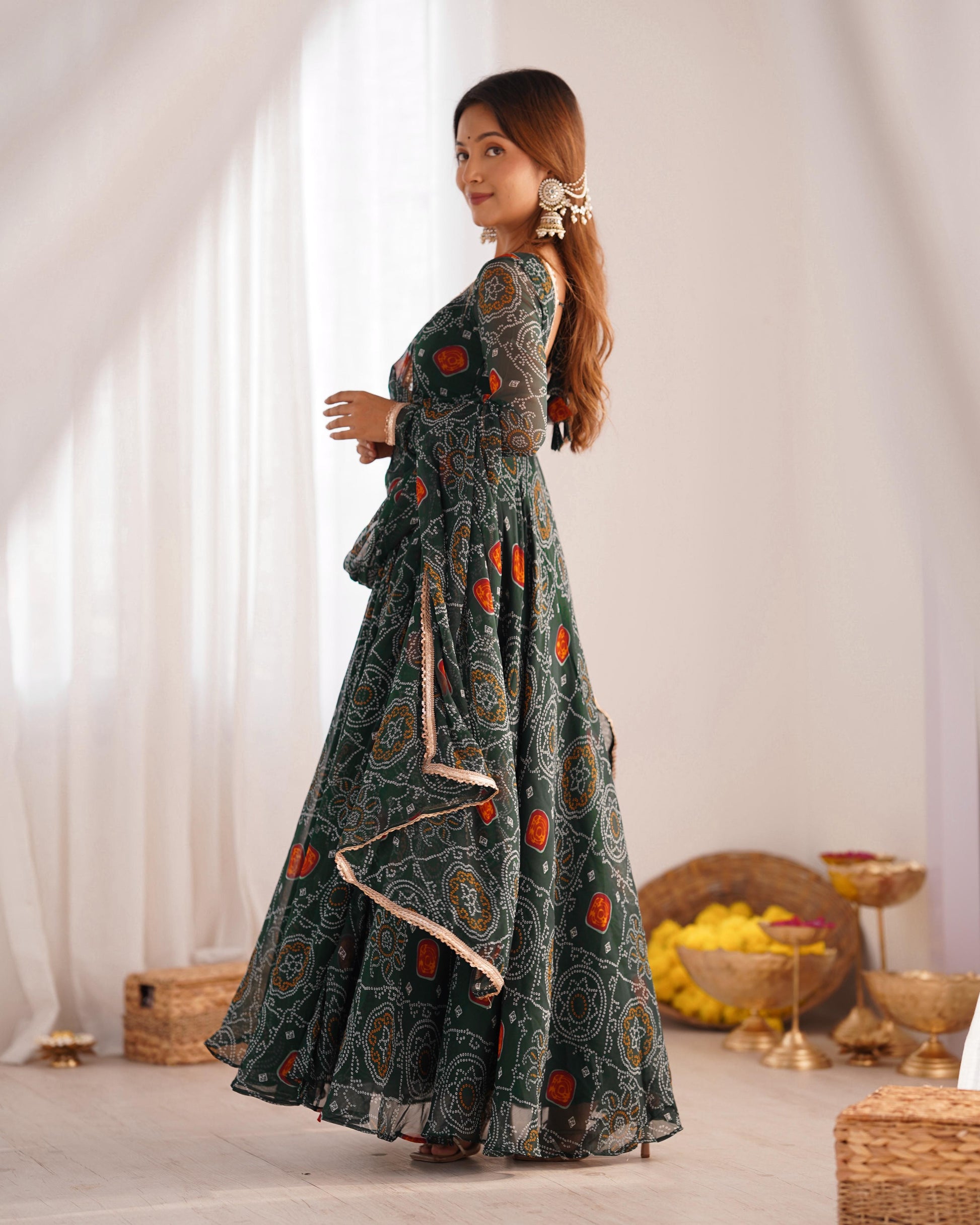 Green color chifforn bandhej printed gown images