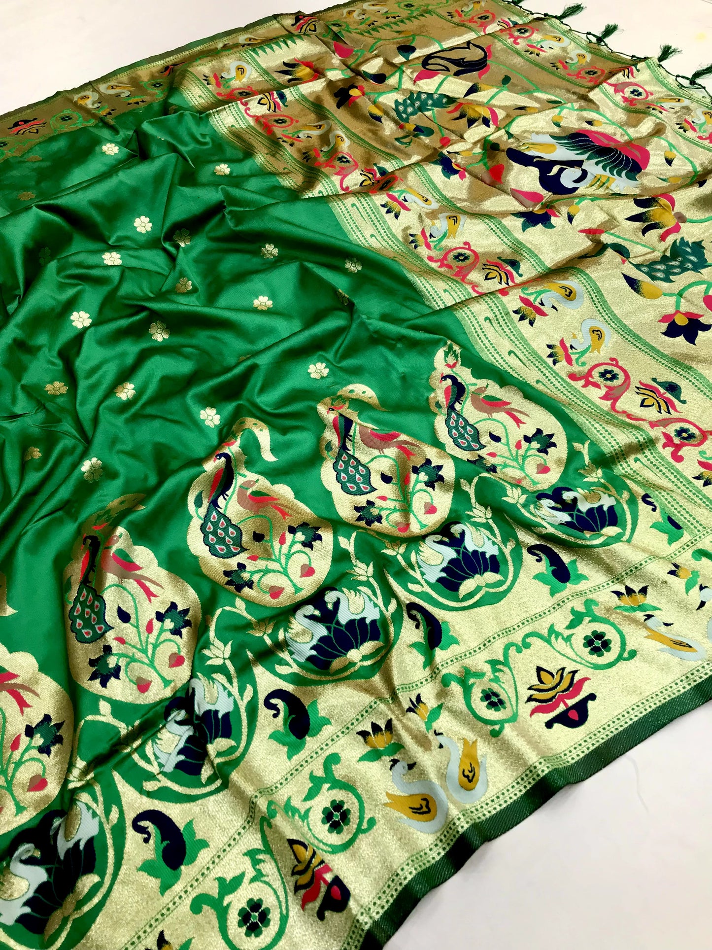 Green color paithani silk saree for women with party
