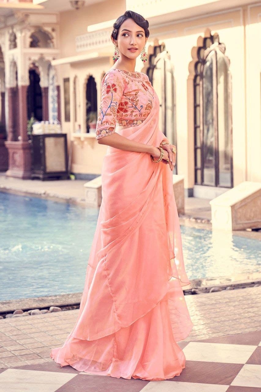 Peach color organza saree with blouse