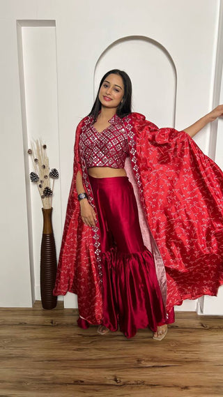 Red mirror work sharara suit with shrug