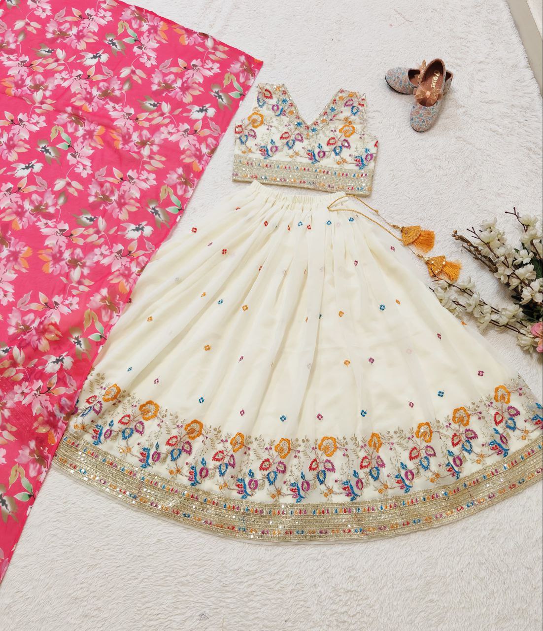 Off white color georgette lehenga choli design