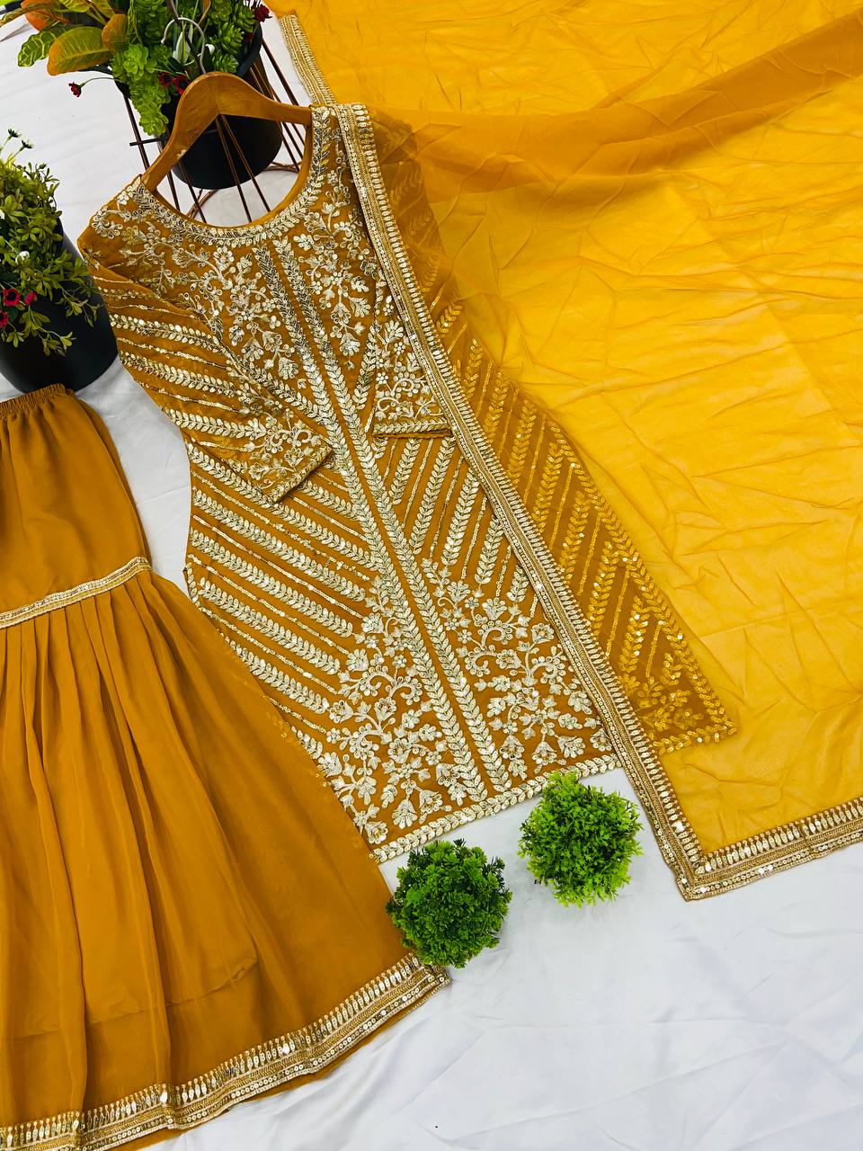 Yellow color chinon silk sharara suit with dupatta price