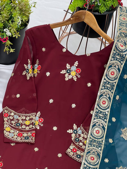 Maroon color georgette sharara suit with dupatta images
