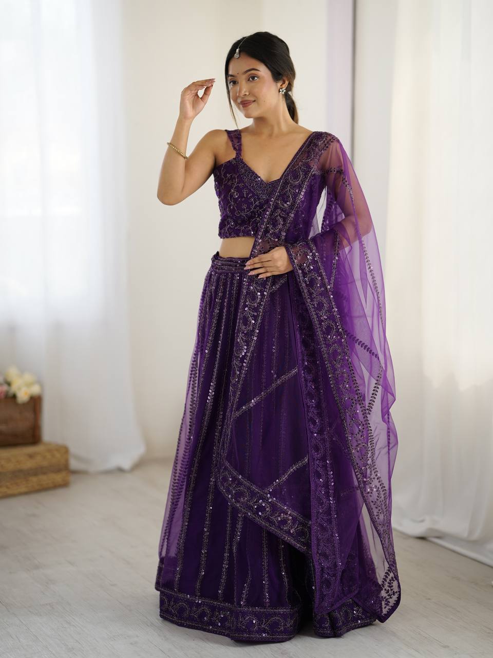 Purple color net lehenga choli with dupatta
